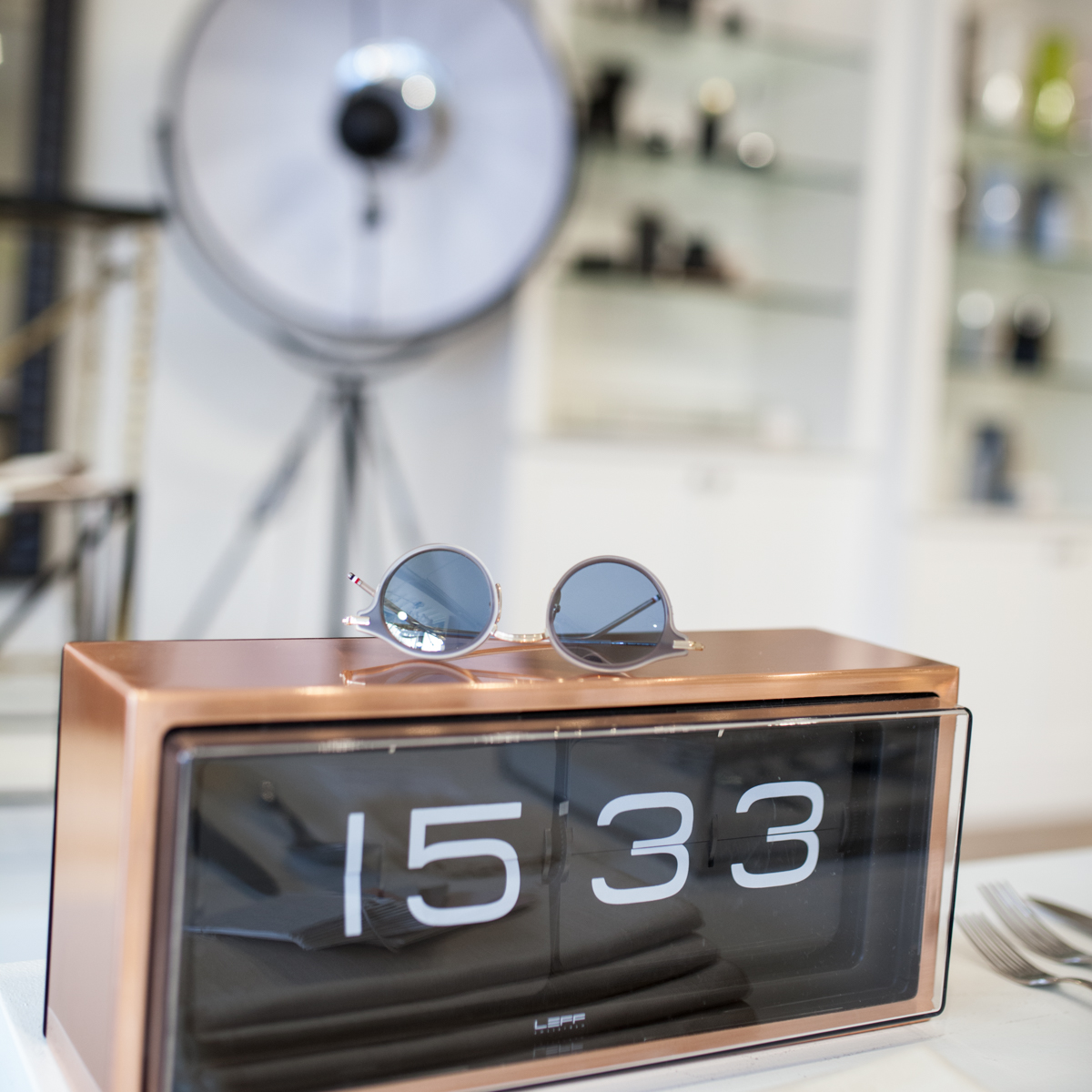 Thom Browne Sunglass TB-807 on top of a Leff Amsterdam Brick Clock in copper.
